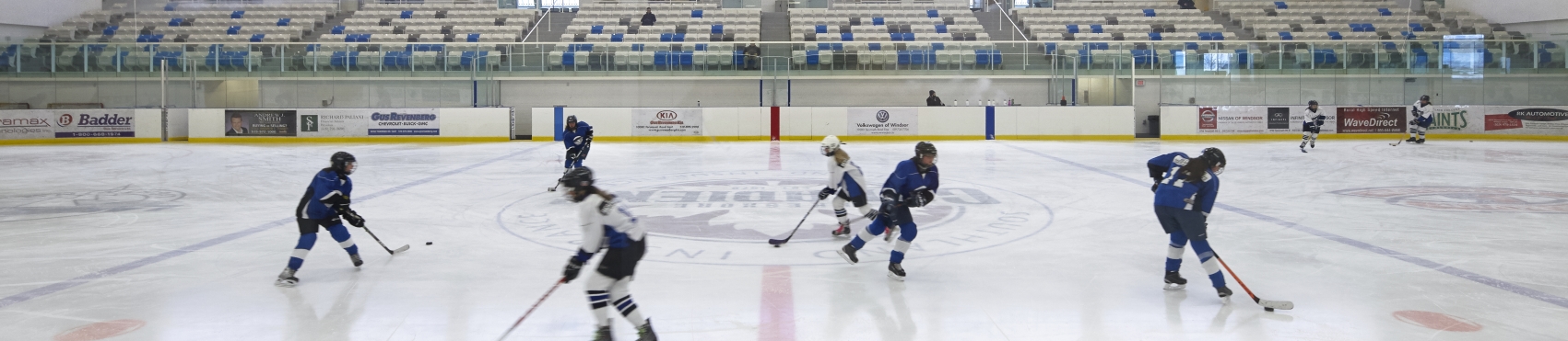 Kids playing hockey in the local arena